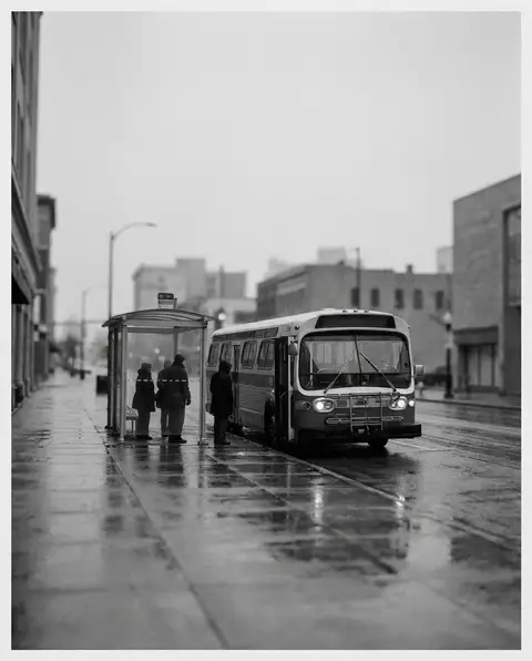 City transit bus stopped at a roadside bus stop