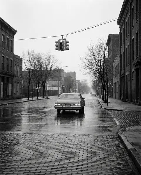 Cars stopped at a Wilmington street intersection beneath a traffic signal