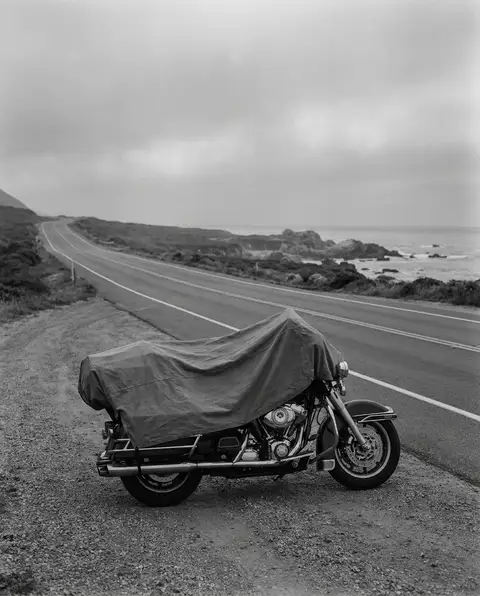 Motorcycle parked on the shoulder of an open coastal North Carolina highway