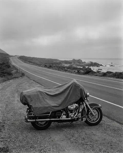 Motorcycle parked on the shoulder of an open coastal North Carolina highway