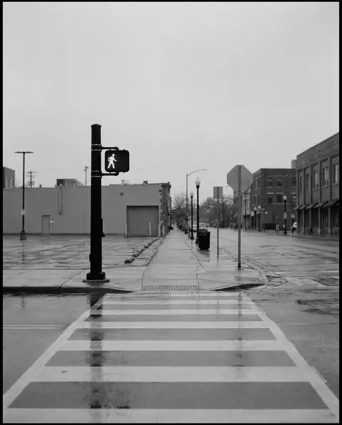 Marked pedestrian crosswalk with a walk signal at a Wilmington intersection